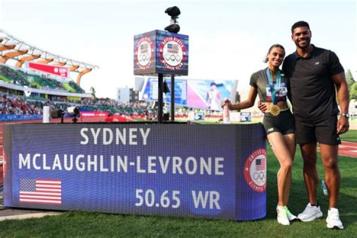 Sydney McLaughlin's Parents Embrace Andre Levrone Jr.